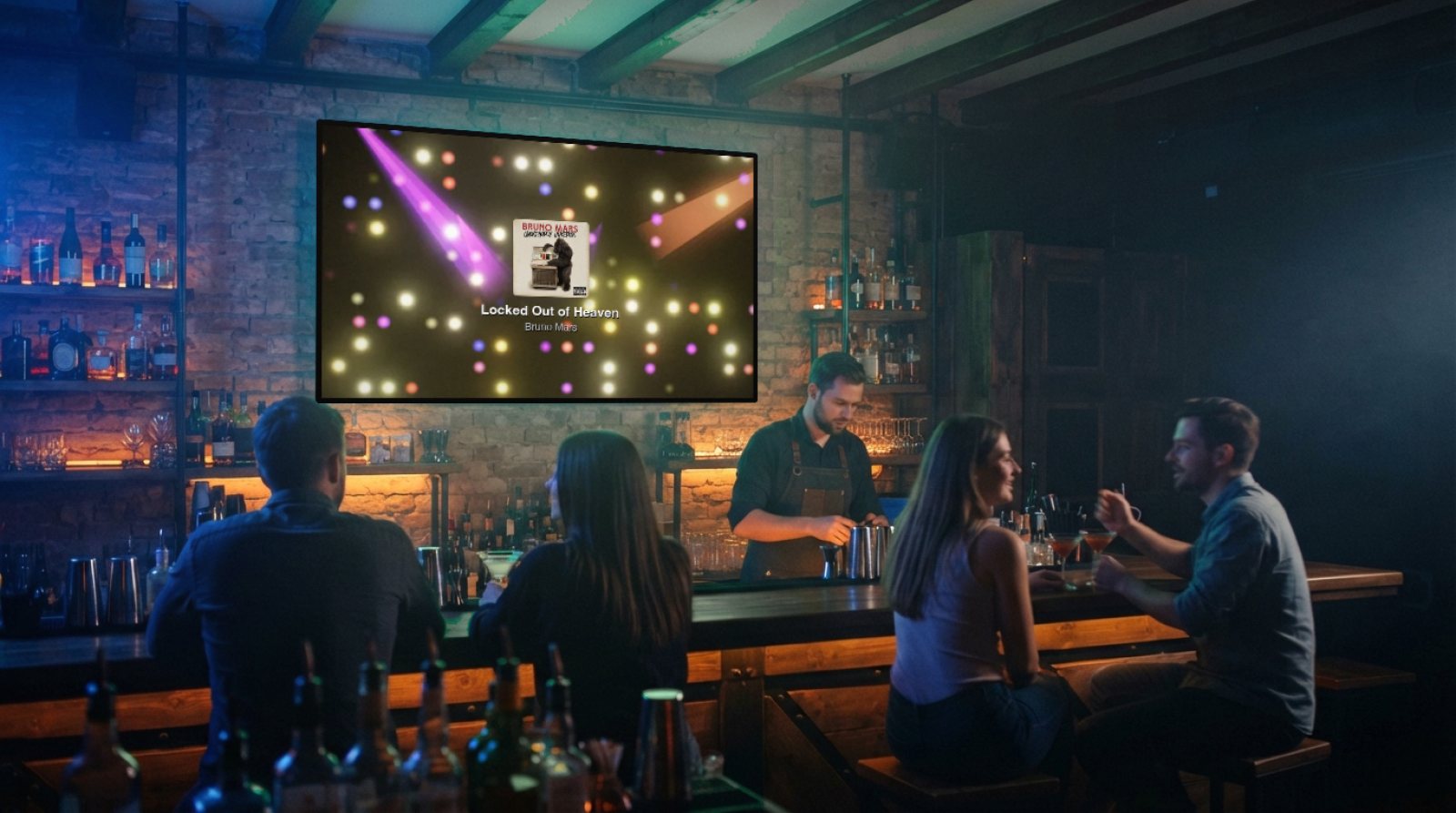 A brick-walled bar, a bartender and customers at the counter; on the large wall screen, Halofloor visuals and the cover of Locked Out of Heaven by Bruno Mars.