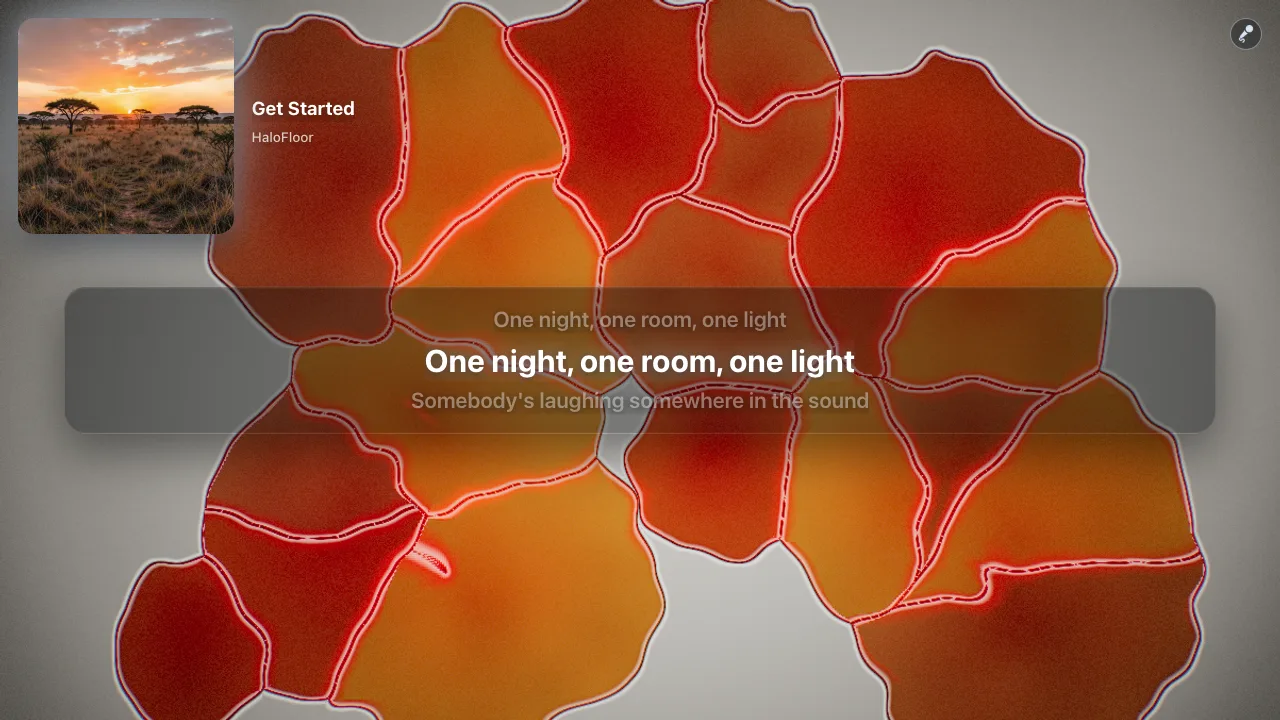 Halofloor karaoke screen: synced lyrics in a box, the line being sung in white, over a colorful LiquidLight visual.