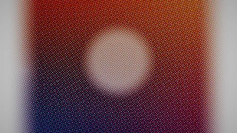 Halftone : Red and blue halftone dots around a glowing disc