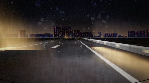 Nightdrive : Night drive down a highway toward city lights