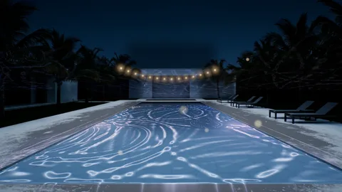 Poolside : a lit swimming pool at night